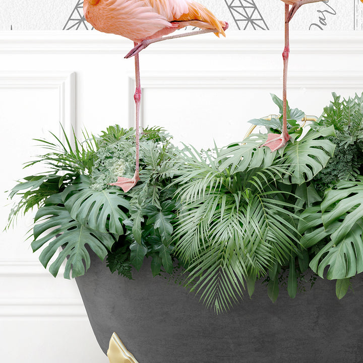 two flamingos are standing on top of a planter