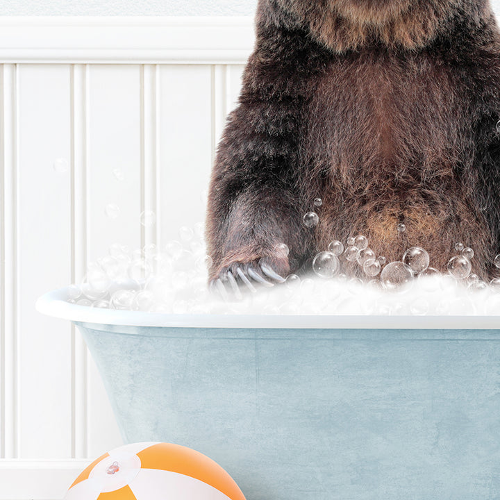 a large brown bear sitting in a bath tub