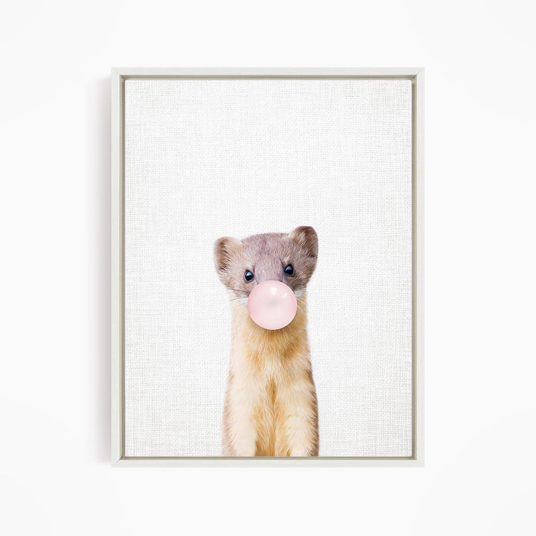A cute beige and brown animal, possibly a small rodent or rodent, is blowing a bubble with a pink bubble gum bubble.