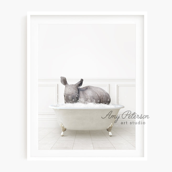 a rhino laying down in a bath tub