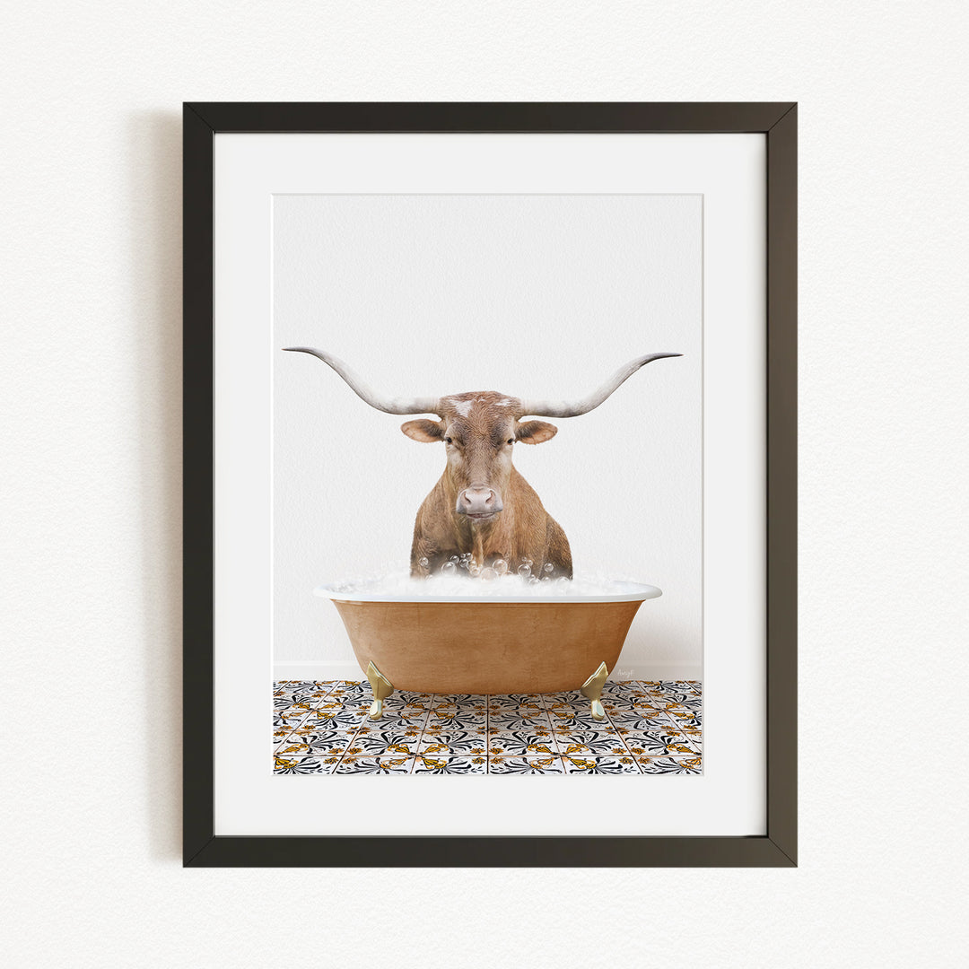 A framed image of a horned cow standing in a bathtub filled with water, with a patterned tile floor beneath.