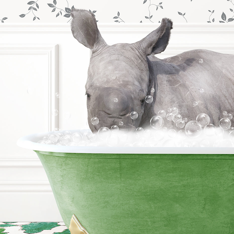 a rhino is taking a bath in a green tub