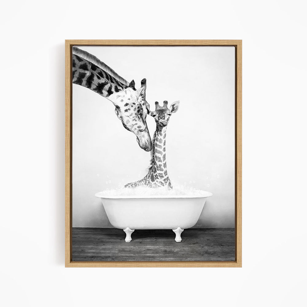 A mother giraffe and her baby giraffe enjoying a bath together in a white bathtub.