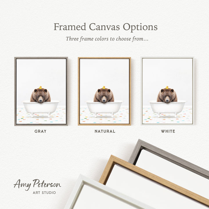three framed canvas options, each featuring a bear in a bathtub. The bear is wearing a yellow crown and appears to be enjoying the bath. The options include a gray frame, a natural frame, and a white frame.