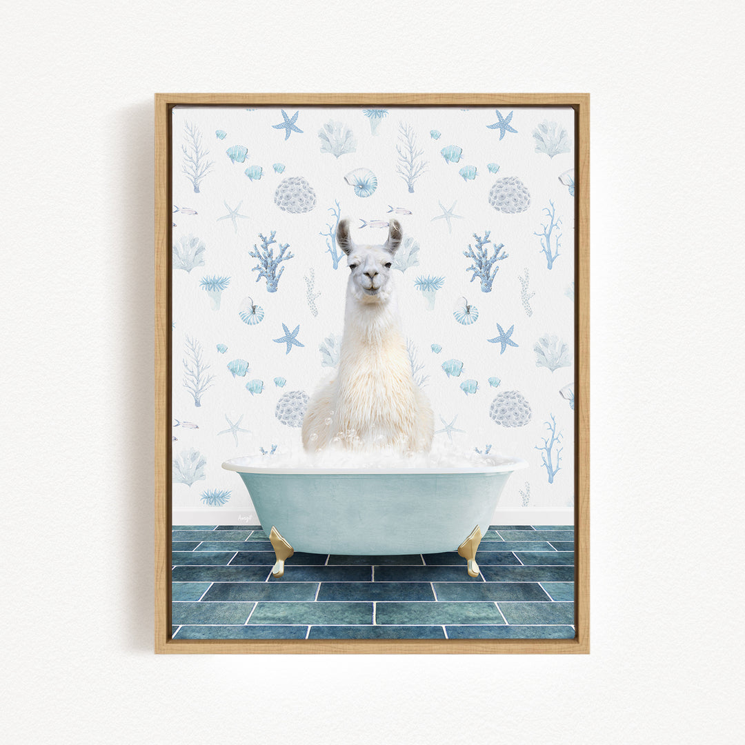 A white llama sitting in a bathtub filled with bubbles, surrounded by a blue and white patterned wall.