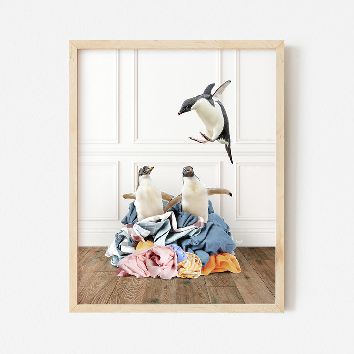 a picture of two birds flying over a pile of clothes