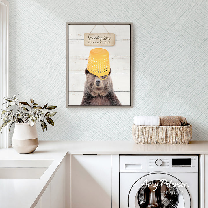 a bear wearing a yellow bucket hat and sunglasses, with a sign above it that says "Laundry Day I'm a basket case".