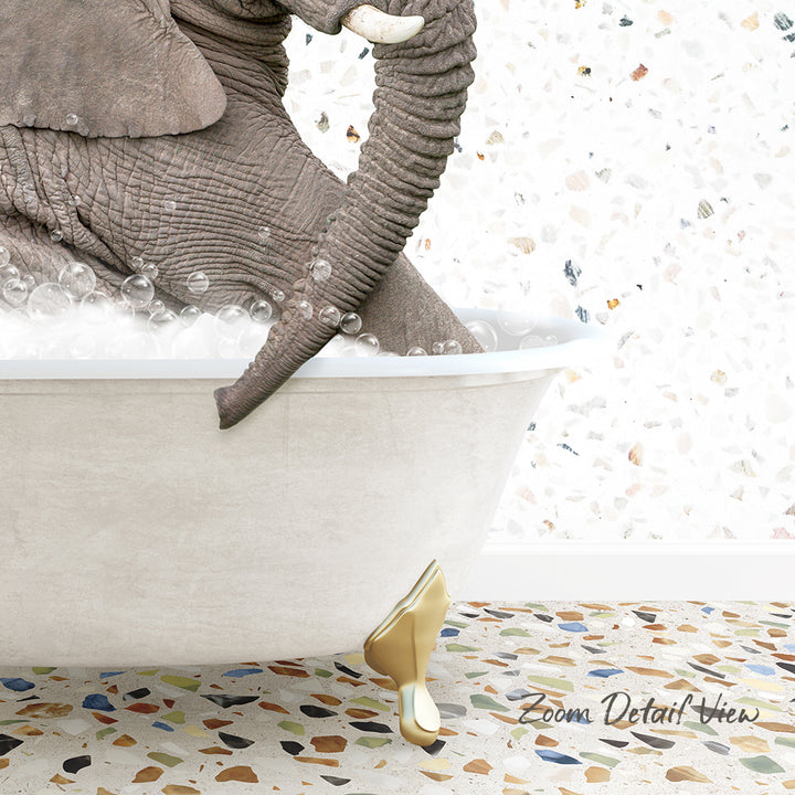 A large elephant is sitting in a bathtub filled with bubbles, with its trunk submerged in the water.