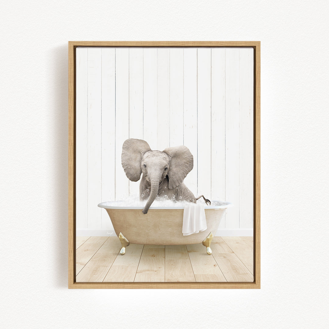 A baby elephant sitting in a bathtub filled with water, surrounded by a wooden floor and white walls.