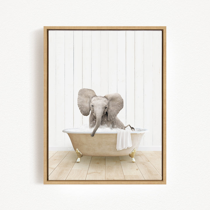 A baby elephant sitting in a bathtub filled with water, surrounded by a wooden floor and white walls.