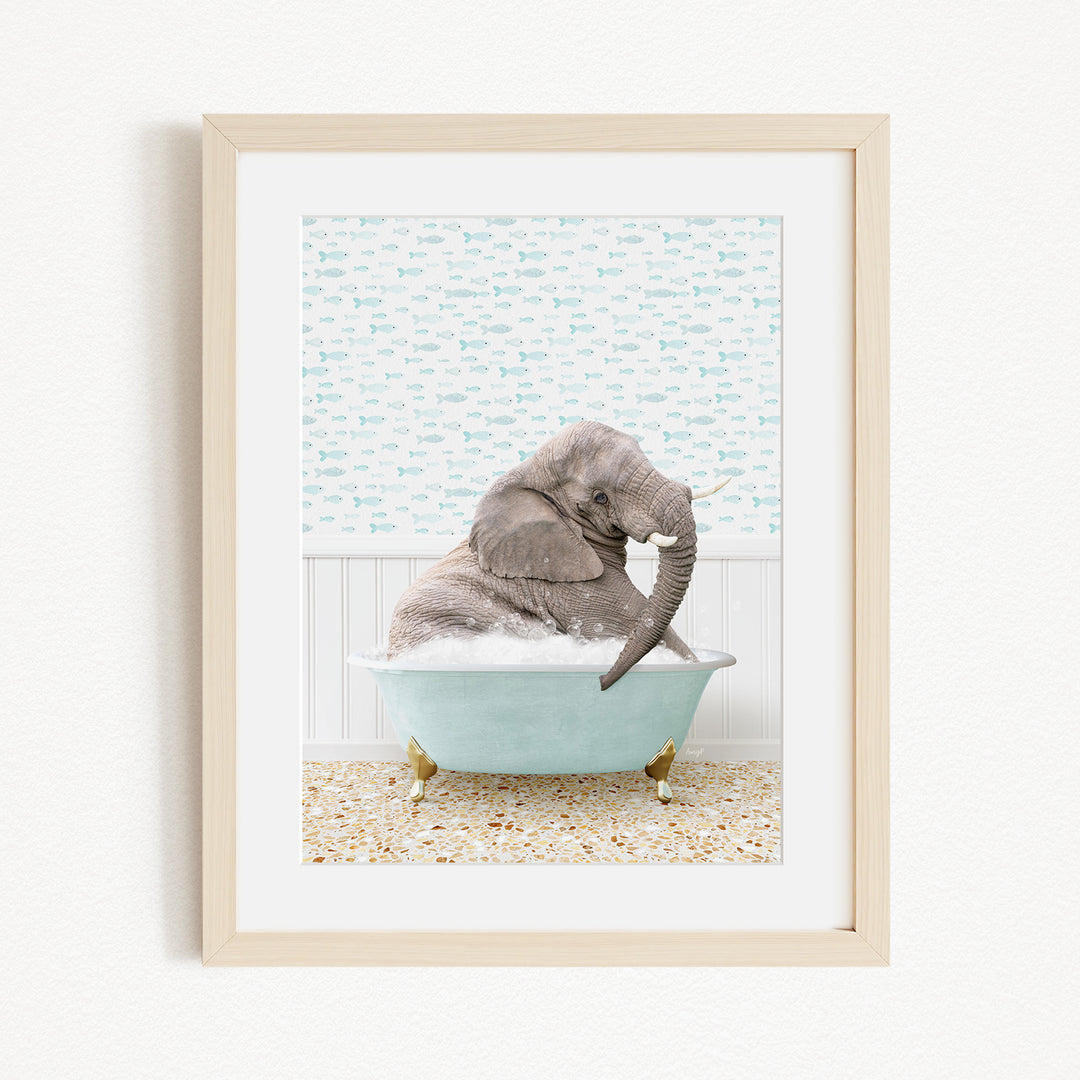 A gray elephant is sitting in a light blue bathtub filled with bubbles, surrounded by a patterned wall and a beige floor.