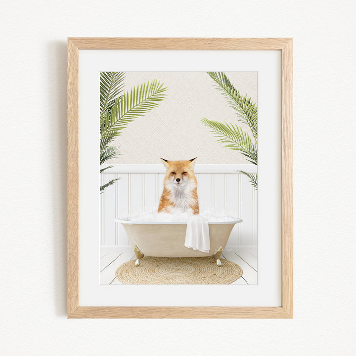 A fox is sitting in a bathtub filled with bubbles, surrounded by green plants.