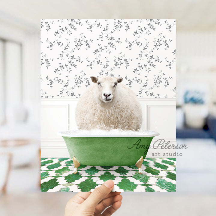 a hand holding a card with a sheep in a bathtub