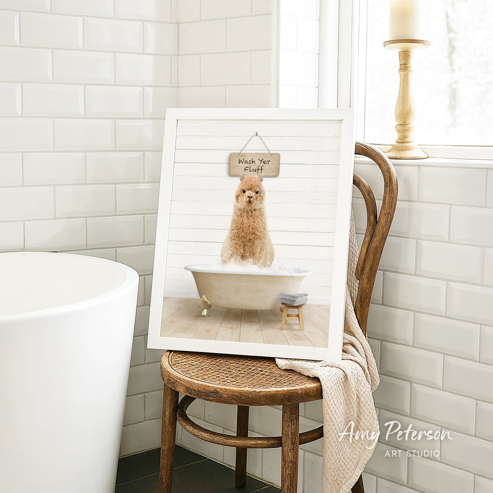 A framed image of a dog sitting in a bathtub, with a sign above it that says "Hush Yer Fluff".