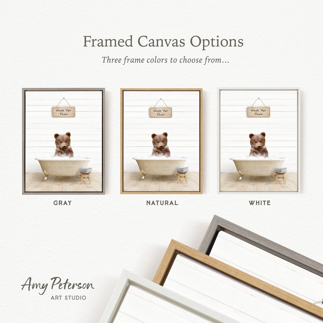 three framed canvas options, each featuring a teddy bear in a bathtub. The options include a gray frame, a natural frame, and a white frame. The text above the images reads " framed Canvas Options" and "Three frame colors to choose from...".