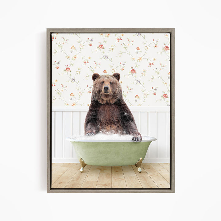 A brown bear sitting in a green bathtub filled with water, surrounded by a floral wallpaper.
