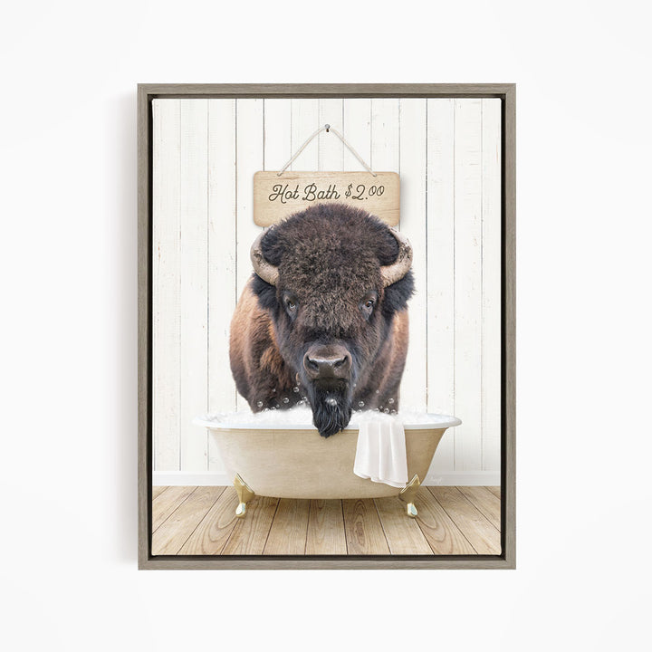 A buffalo is sitting in a bathtub, with a sign above it that says "Hot Bath $2.00".