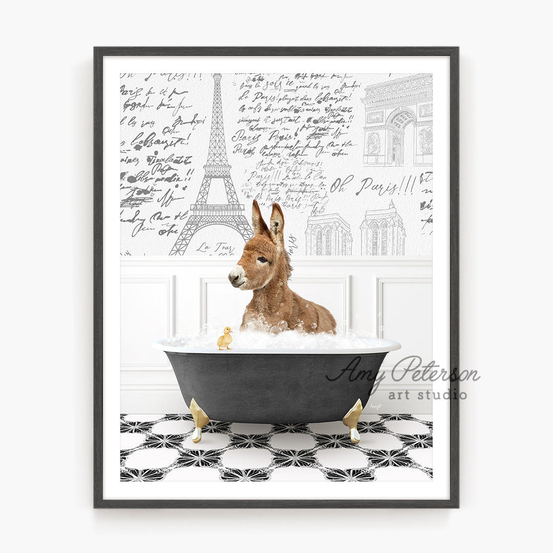 a dog sitting in a bathtub with the eiffel tower in the background