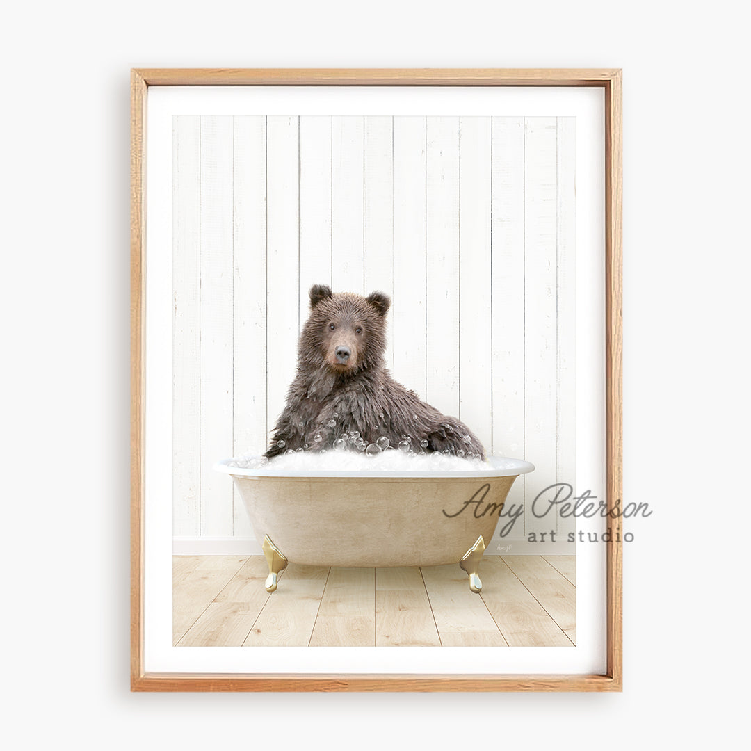 a brown bear sitting in a bath tub