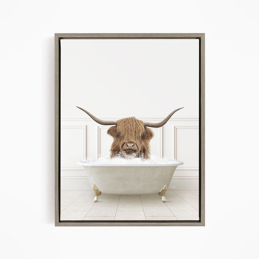 A brown cow with long horns is sitting in a white bathtub filled with water, appearing to enjoy the bath.