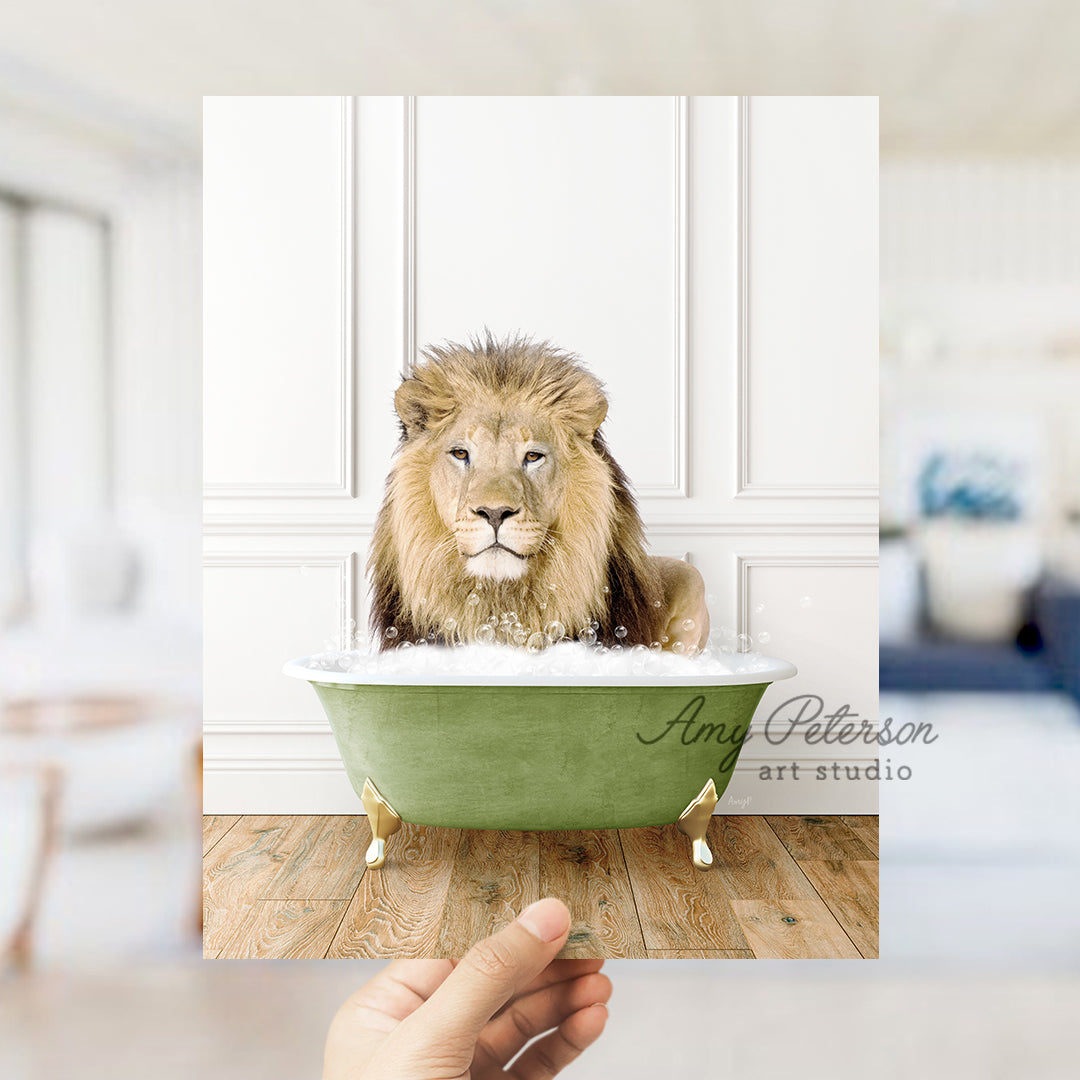 a lion sitting in a bathtub with a hand holding it