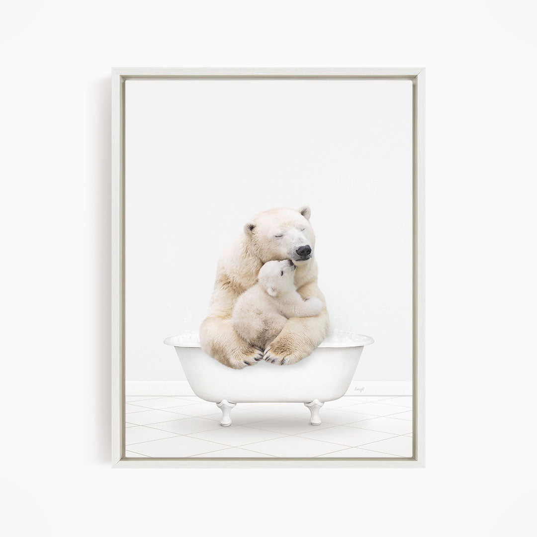 A mother polar bear and her cub cuddling in a white bathtub against a white background.