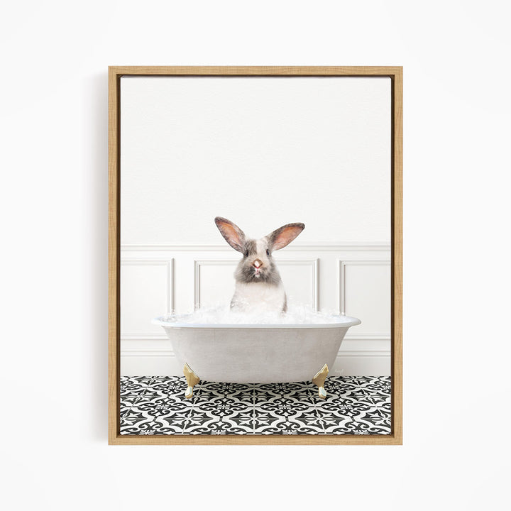 A white rabbit sitting in a white bathtub filled with water, with a black and white patterned floor in the background.