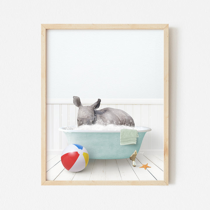 a picture of a cat in a bathtub with a beach ball