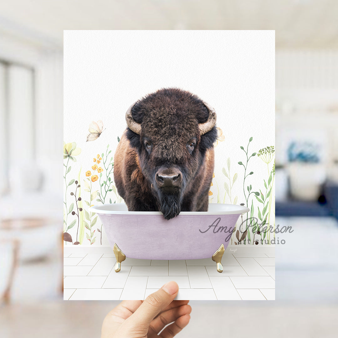 a person holding a card with a picture of a bison in a bathtub