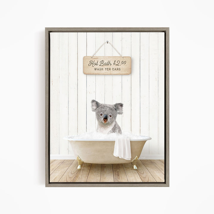 A koala bear sitting in a bathtub, with a sign above it that says "Hot Bath $2.00 WASH YER EARS".
