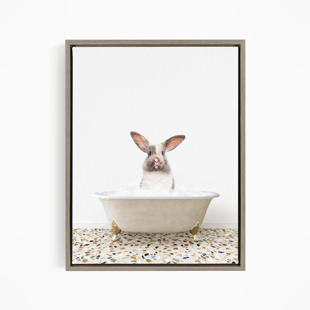 A white rabbit sitting in a white bathtub filled with water, with its head poking out of the tub.