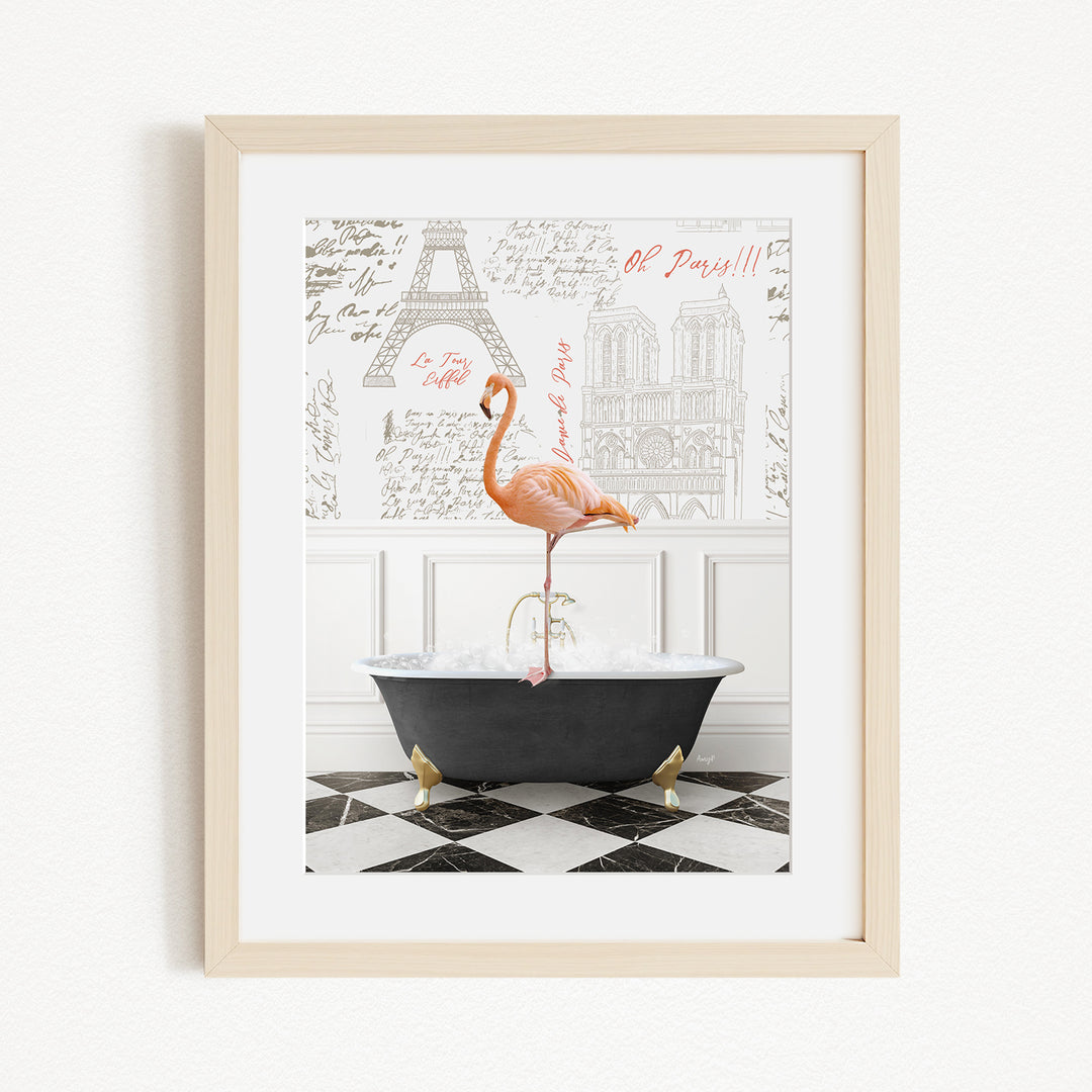 A framed image depicting a pink flamingo standing in a bathtub, with a black and white checkered floor and a framed image of the Eiffel Tower in the background.