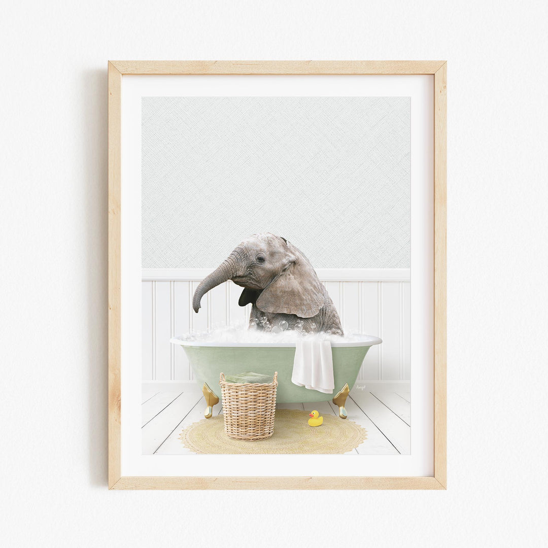 A gray elephant is sitting in a green bathtub filled with water, surrounded by rubber ducks and a basket.