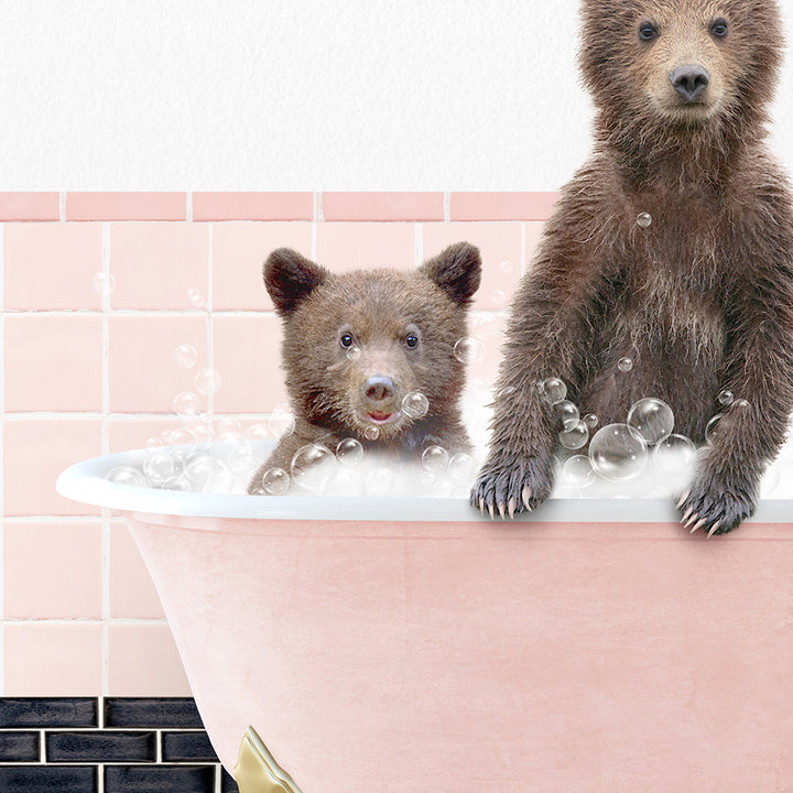 two brown bears are sitting in a bathtub