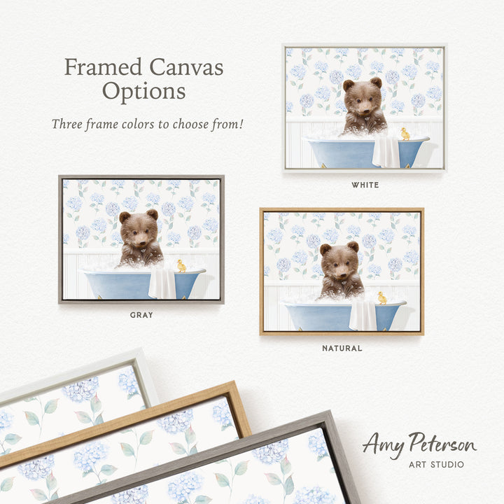 The image is a framed canvas with three different options for the color of the frame: white, gray, and natural. The canvas features a brown bear sitting in a bathtub, surrounded by blue flowers.