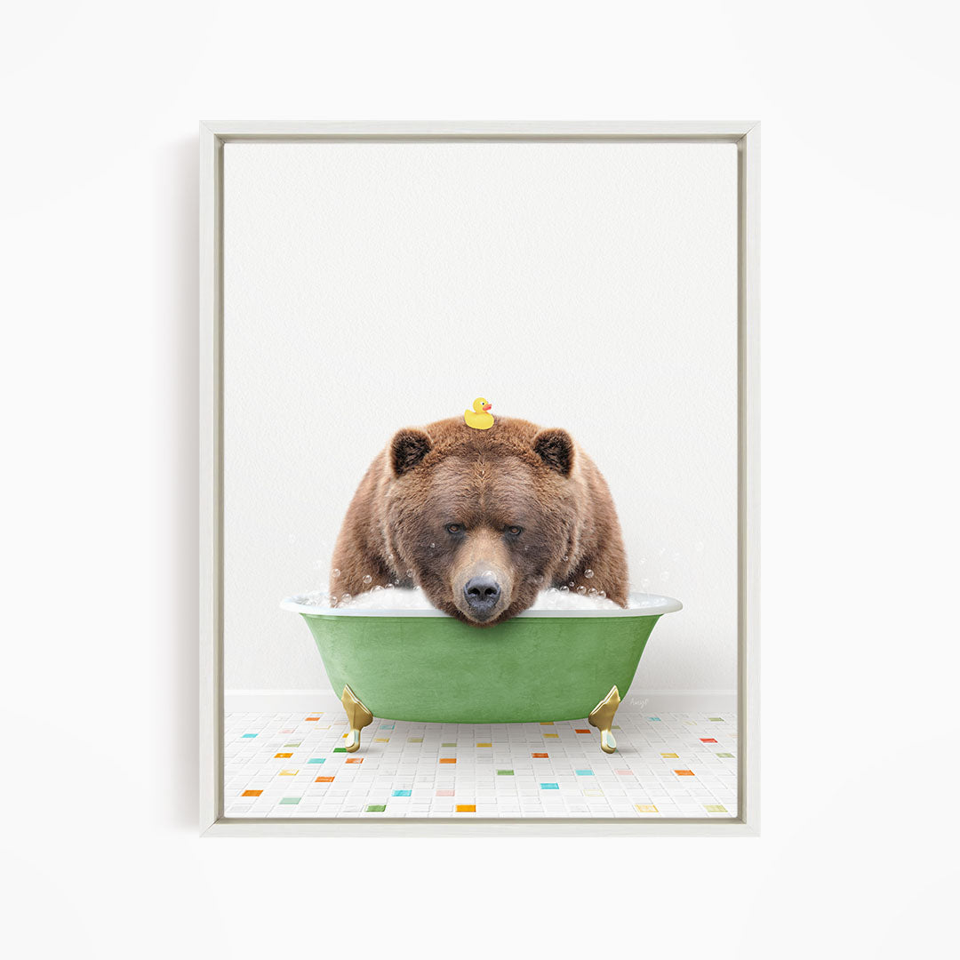 A brown bear is sitting in a green bathtub, surrounded by rubber ducks.