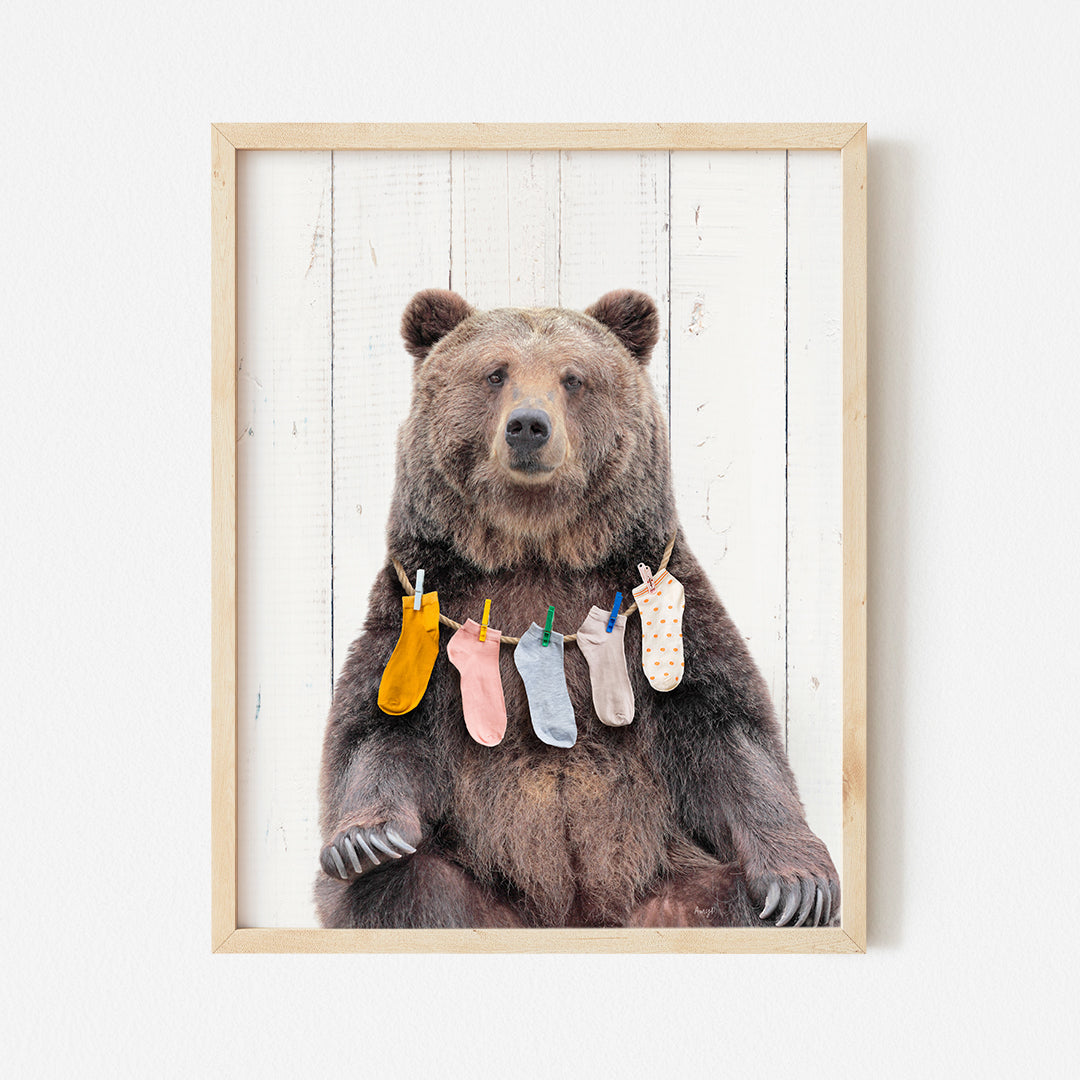 a picture of a bear with socks hanging from it's legs