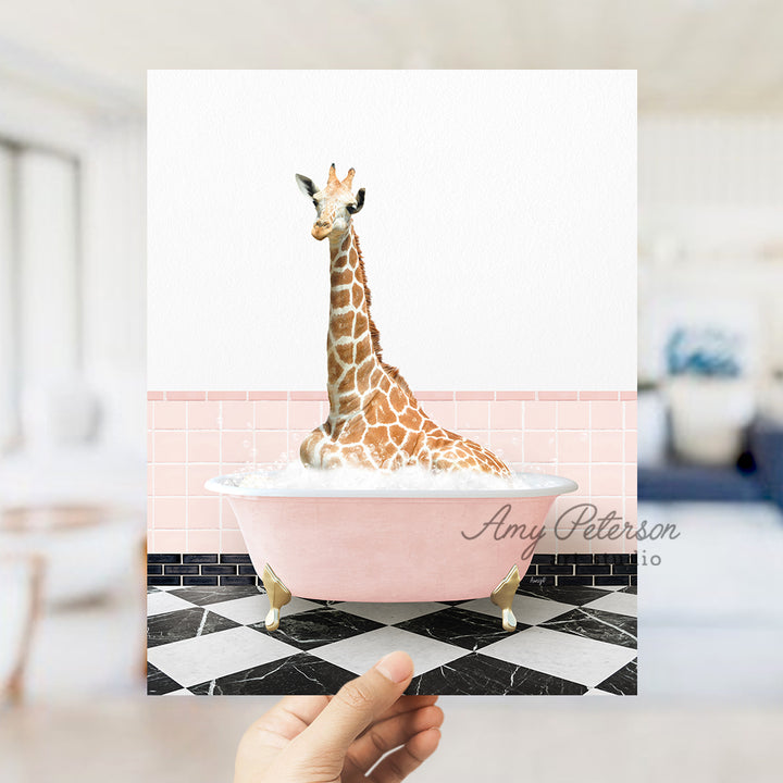 a giraffe sitting in a bathtub with a name on it