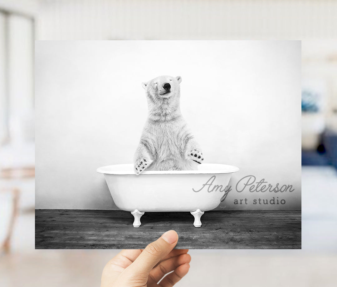 a polar bear is sitting in a bathtub