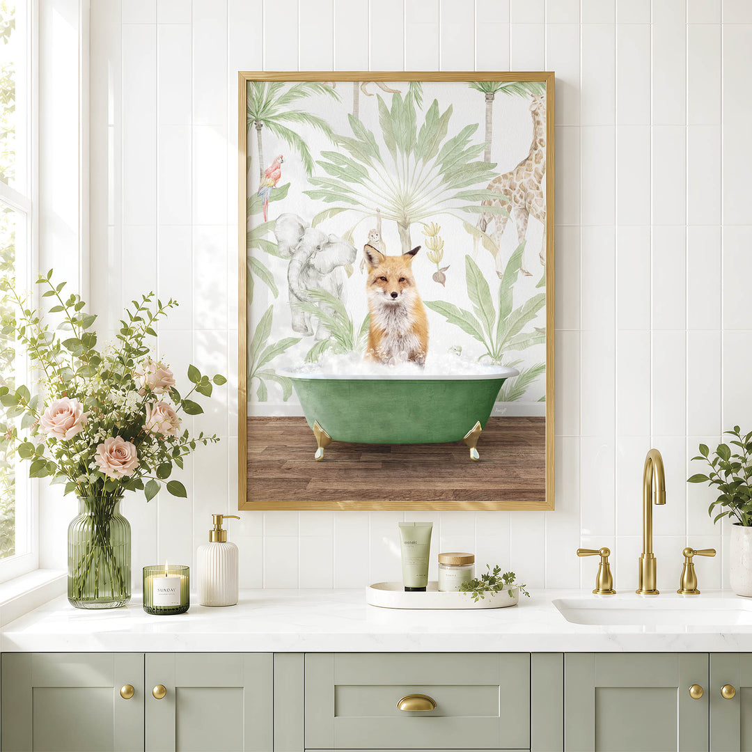 a framed picture of a fox sitting in a green bathtub, surrounded by tropical foliage, on a white tiled wall above a bathroom counter with various toiletries and a vase of flowers.