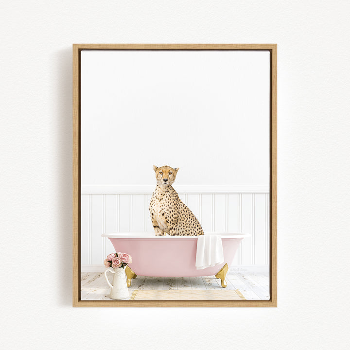 A cheetah sits in a pink bathtub, surrounded by a vase of flowers and a white pitcher, creating a whimsical and charming scene.