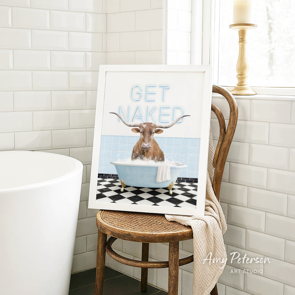 a framed print of a bull with horns sitting in a bathtub, surrounded by a checkered floor and a window.