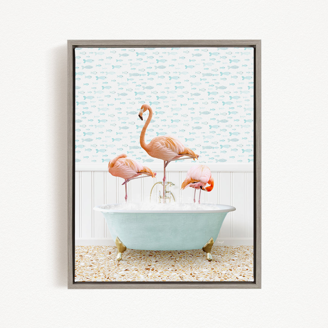 A framed image depicting three flamingos standing in a bathtub filled with water, with a patterned wall behind them.