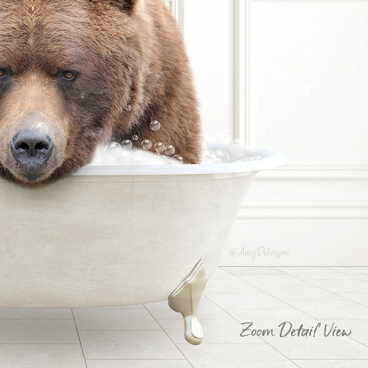 A close-up of a brown bear sitting in a white bathtub filled with bubbles, with a caption that reads "Zoom Detail View".