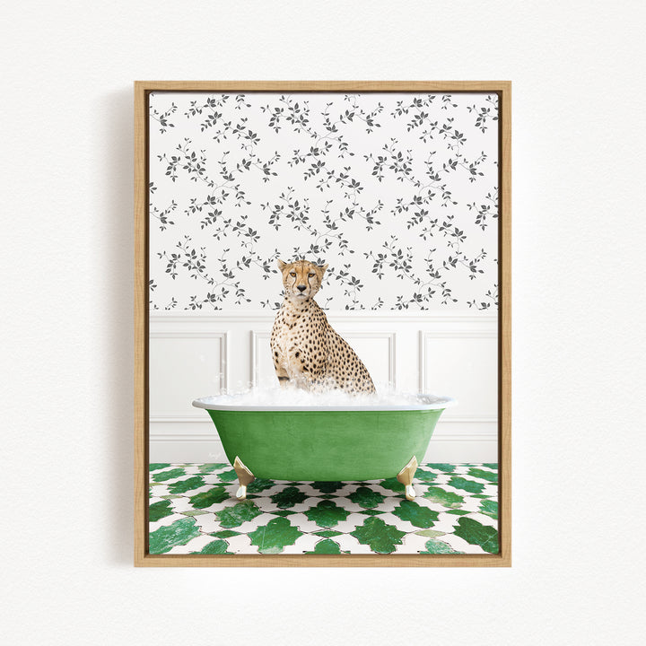 A cheetah sitting in a green bathtub filled with water, surrounded by a patterned wall and green and white floor tiles.