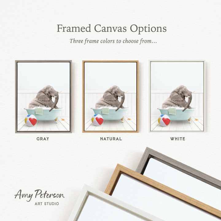 The image is a framed canvas option showcasing three different frame colors: gray, natural, and white. The canvas features a gray elephant sitting in a bathtub with a red and white beach ball nearby.