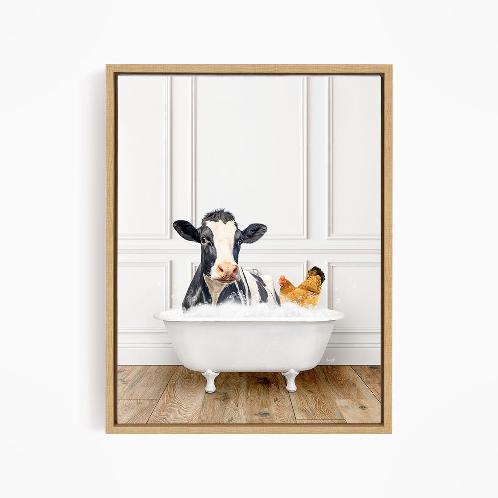 A black and white cow is sitting in a white bathtub, with a chicken nearby, in a white-walled room with a wooden floor.