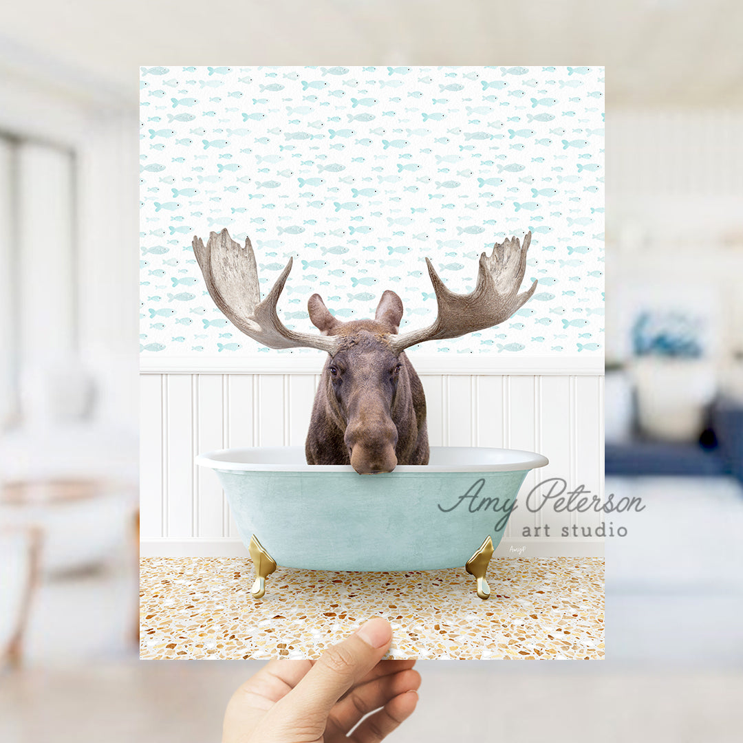 a person holding up a card with a picture of a moose in a bathtub