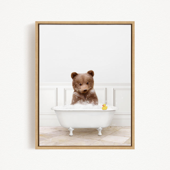 A brown bear sitting in a white bathtub filled with bubbles, with a rubber duck floating nearby.