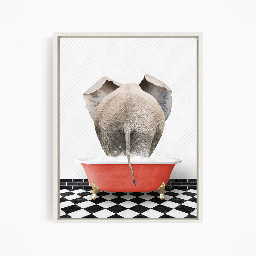An elephant is standing in a red bathtub filled with water, with its trunk submerged in the water.